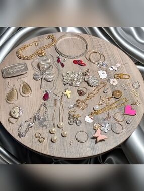 Estate Jewelry Mix: Vintage Charms, Crystal Studs, and Sterling Silver Earrings.